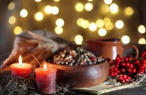 Bowl with kutia -  traditional Christmas sweet meal in Ukraine, Belarus and Poland, on wooden table, on bright background